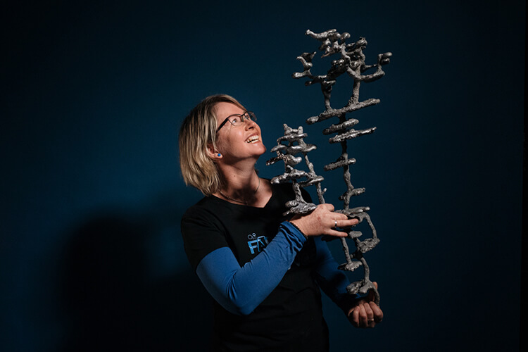 Kirsti Abbott with a casting of an ant nest.