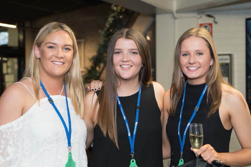Three female students dressed up for the formal farming futures dinner