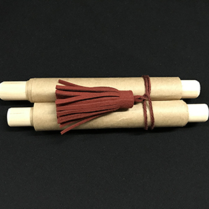 Replica paper scroll with red tassels 