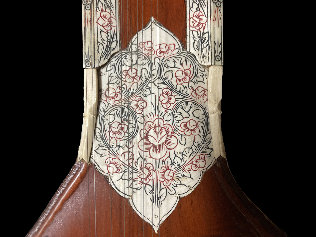 Intricate artwork on an Indian folk instrument