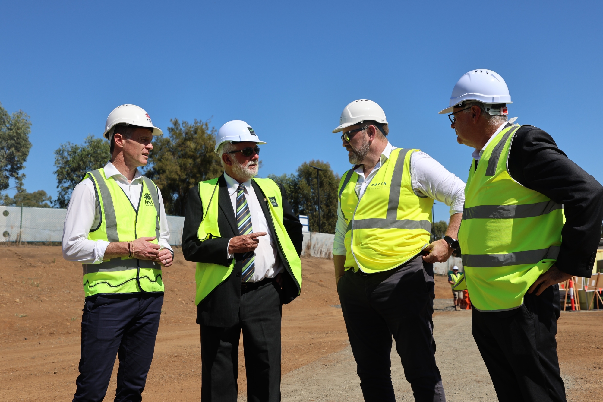 four men in high vis