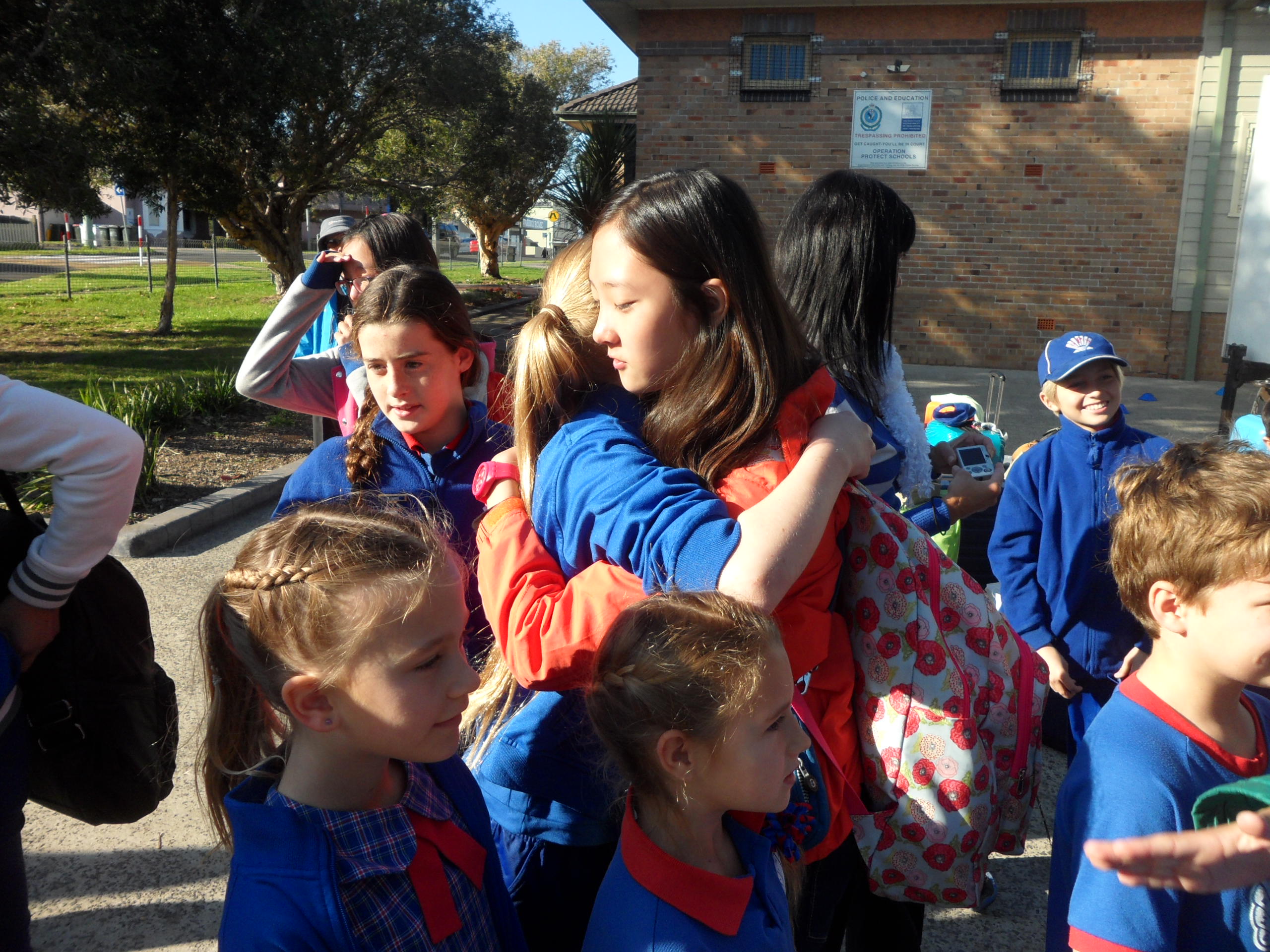 Students hugging during Kyoree Shellhorbour School Visit.