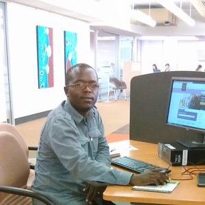UNE graduate studying in the Dixson Library