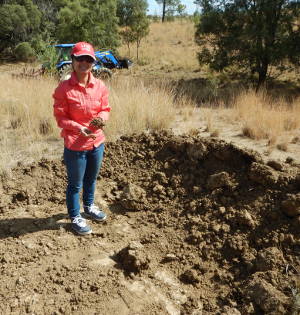 Rubeca Fancy working on soil research in the field
