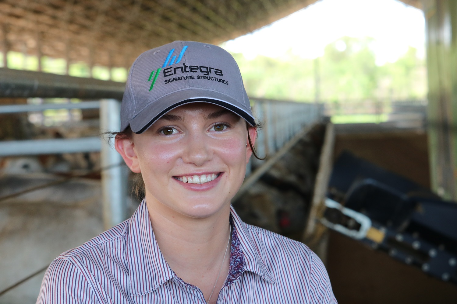Ellie Ireson smiles at the camera wearing an Entegra cap after being announced as the Kenneth Rayner Agriculture Scholarship for the Northern Territory 