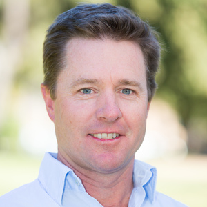 Bachelor of Agricultural Economics graduate Nick Pearce professional headshot in sky blue shirt