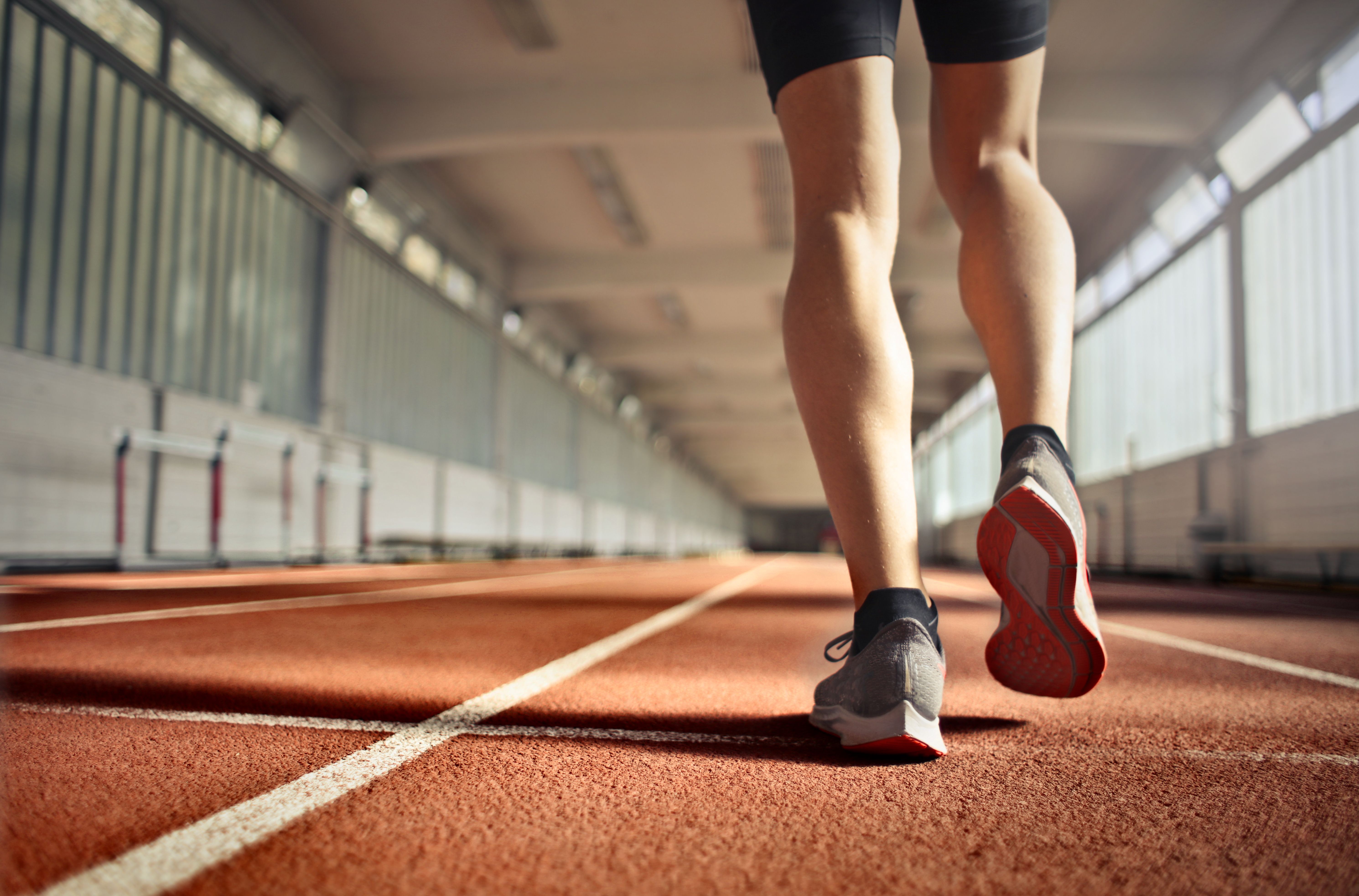 Athlete walking on a track.