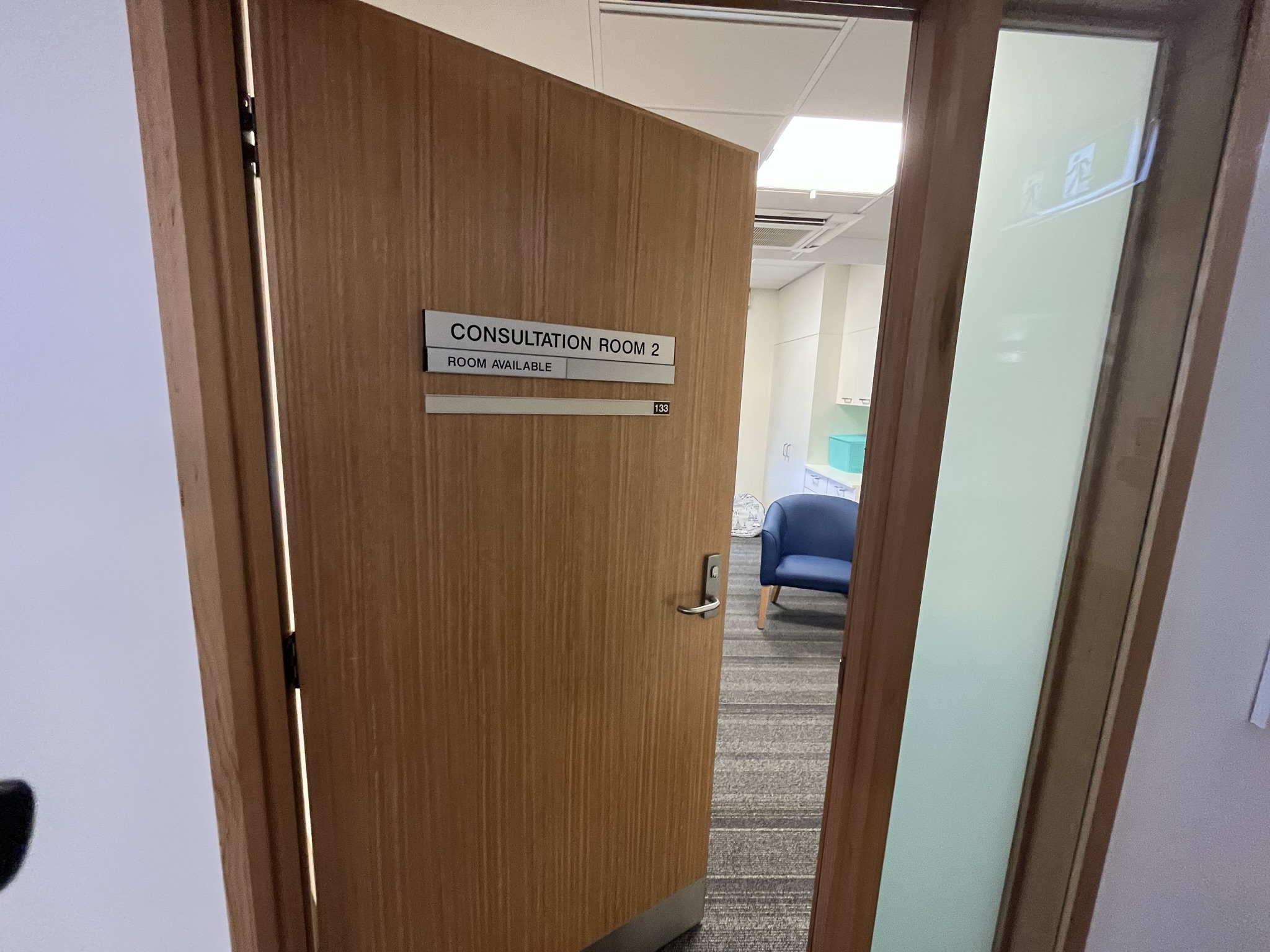 Psychology consultation room door slightly open 
