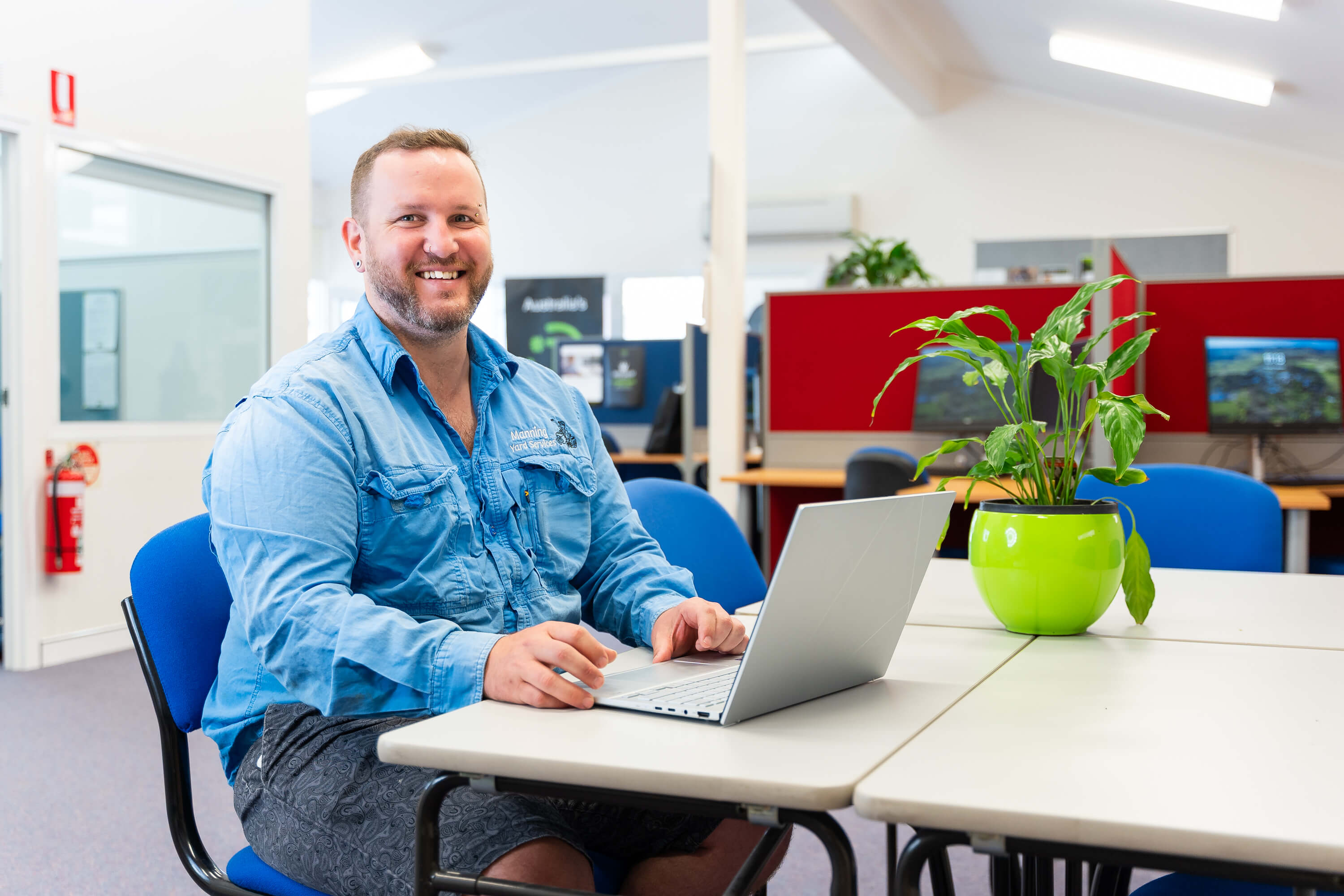 Man sitting at laptop.