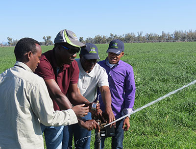 African course participants learning about irrigation systems