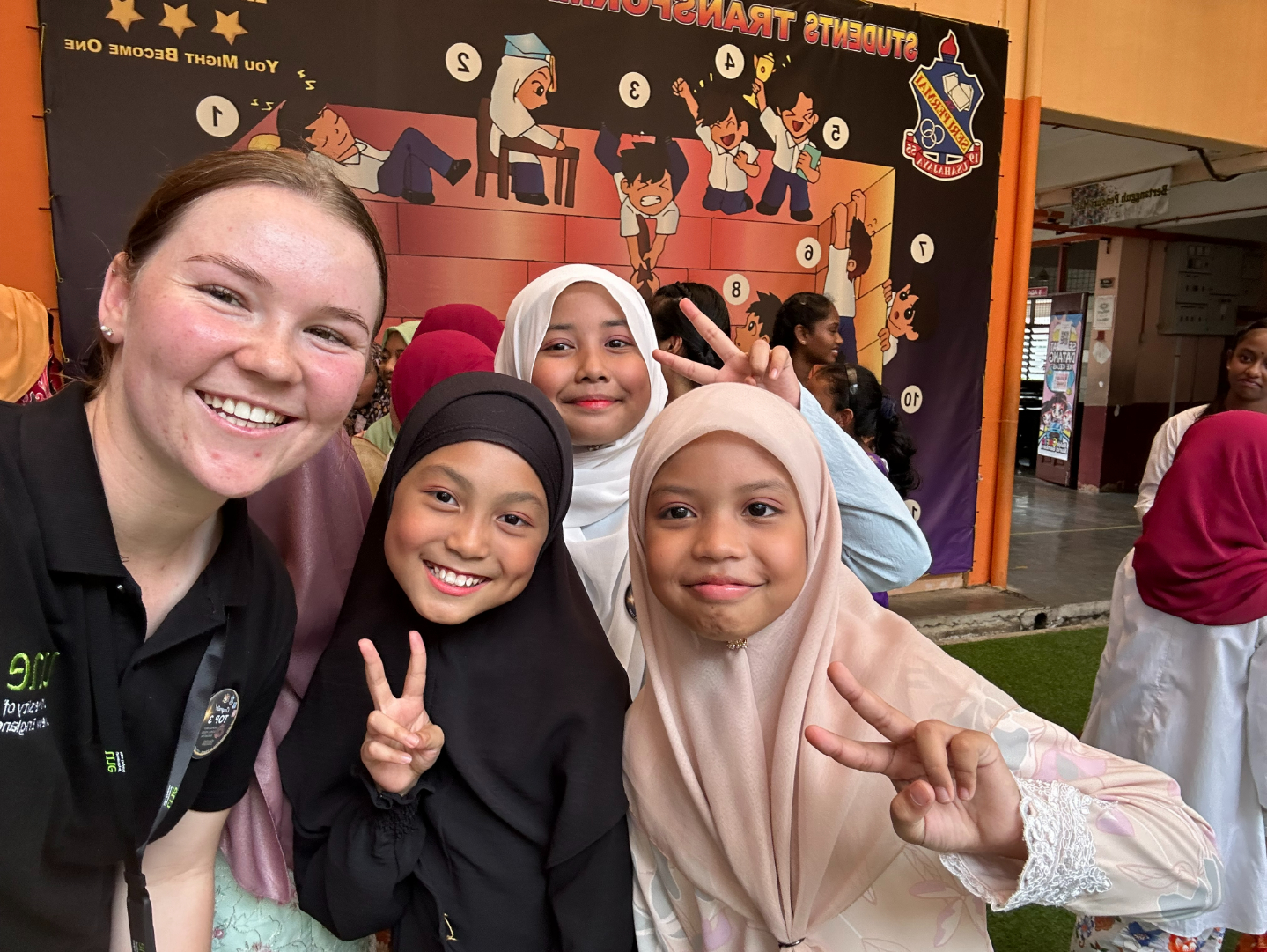 Jess with Malaysian students during UNE's cultural exchange