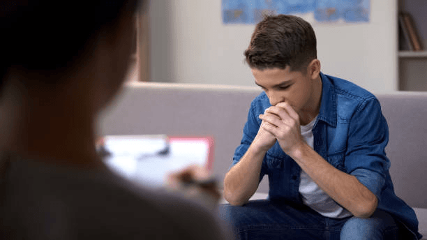 Young man being counselled.