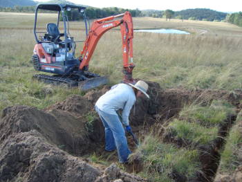 Chris Fyfe working on soil research in the field