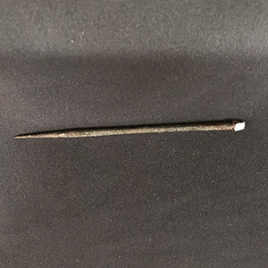 Small metal nail-like implement for etching wax tablets 
