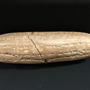 Cylindrical ancient inscribed clay tablet