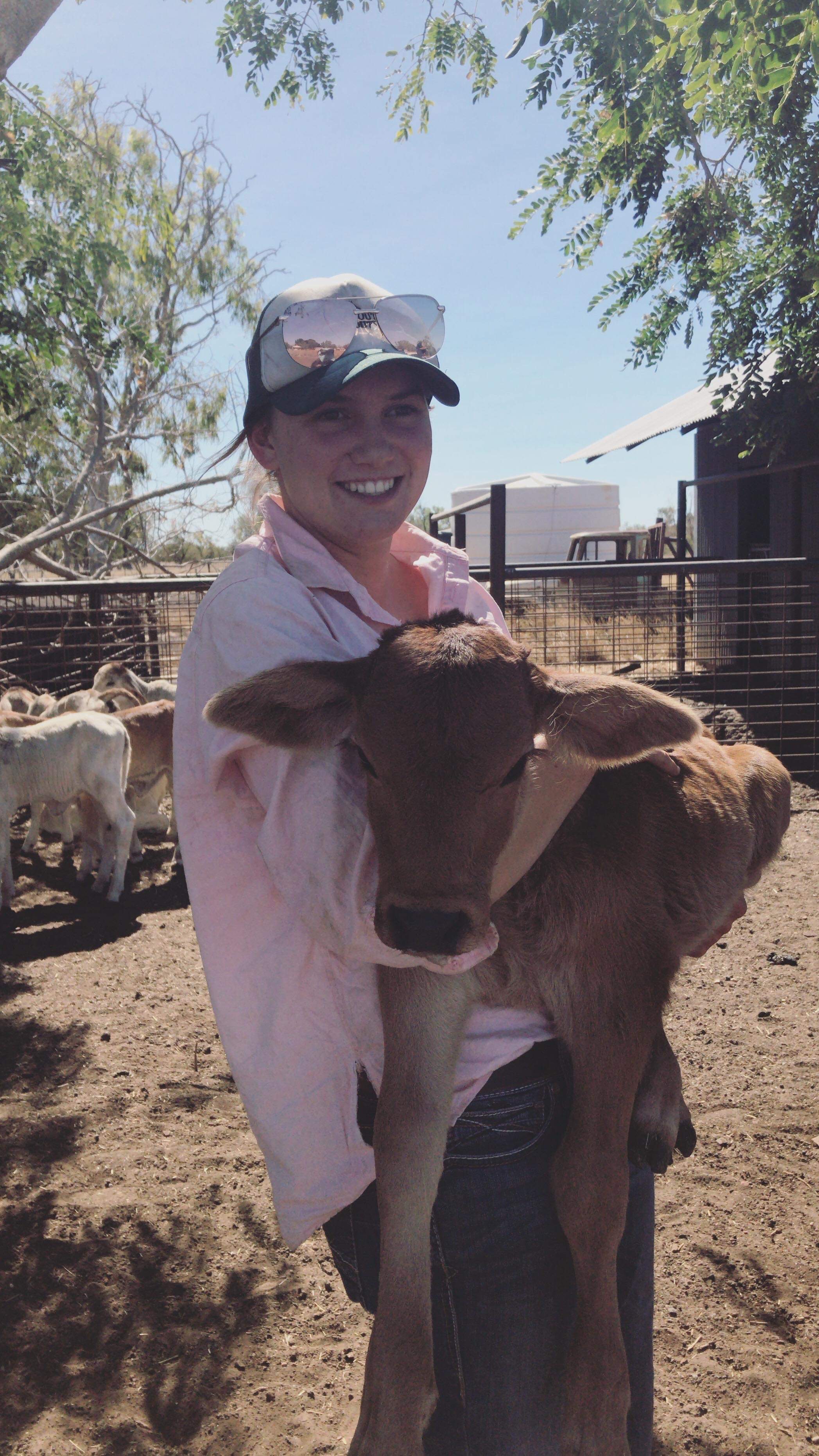 Ellie Ireson holds a calf.