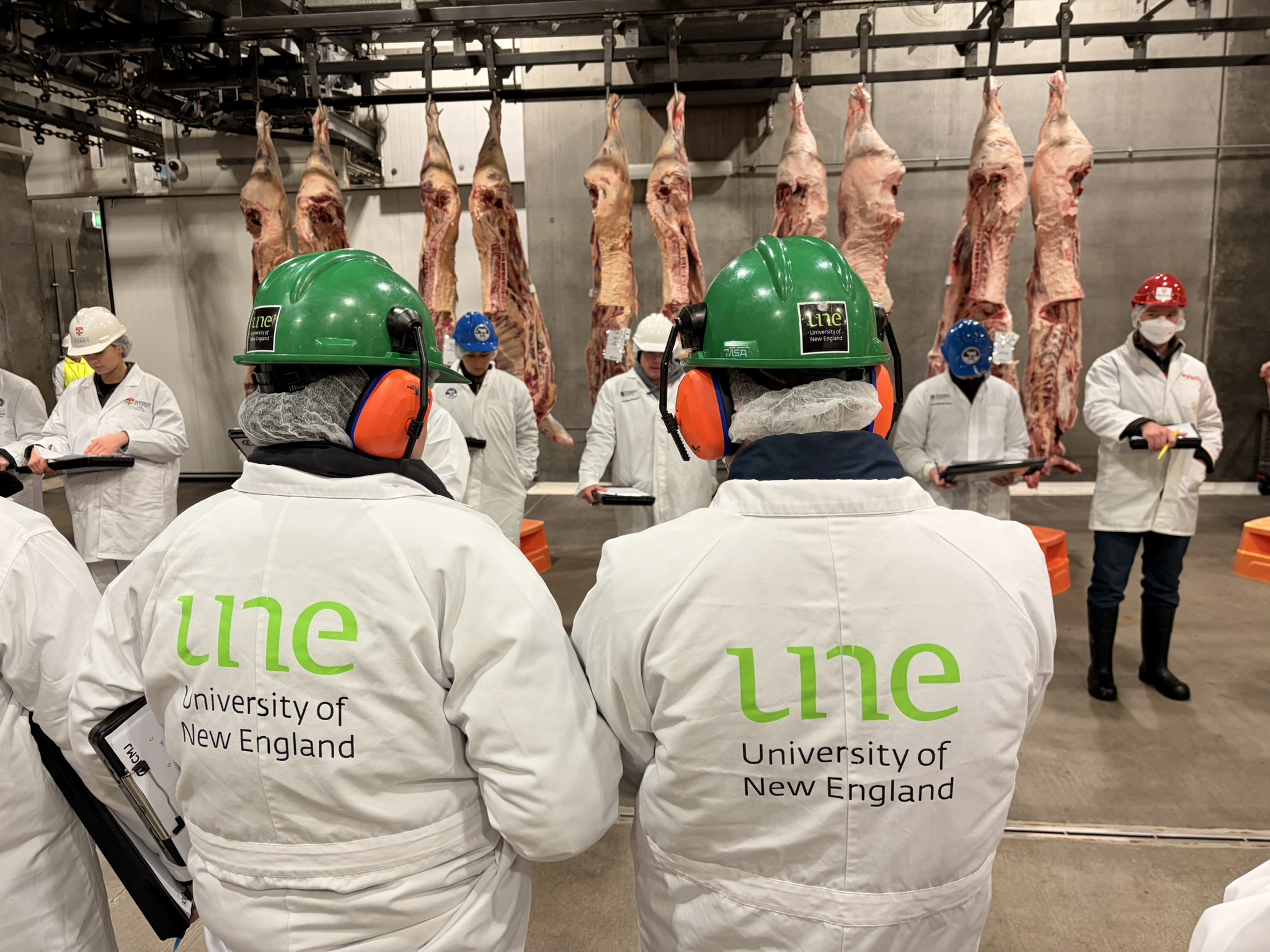 UNE lab coats at ICMJ