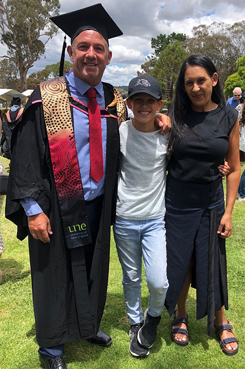 Craig Raymond with his family at graduation
