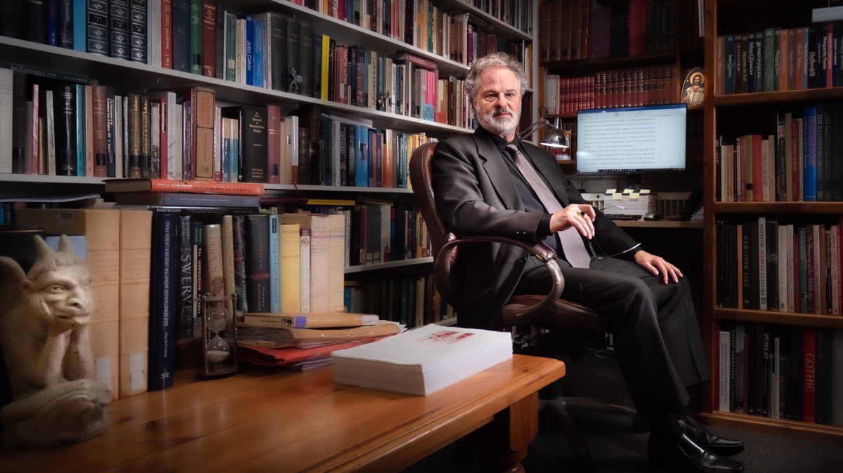Professor Thomas Fudge in his book-lined office.
