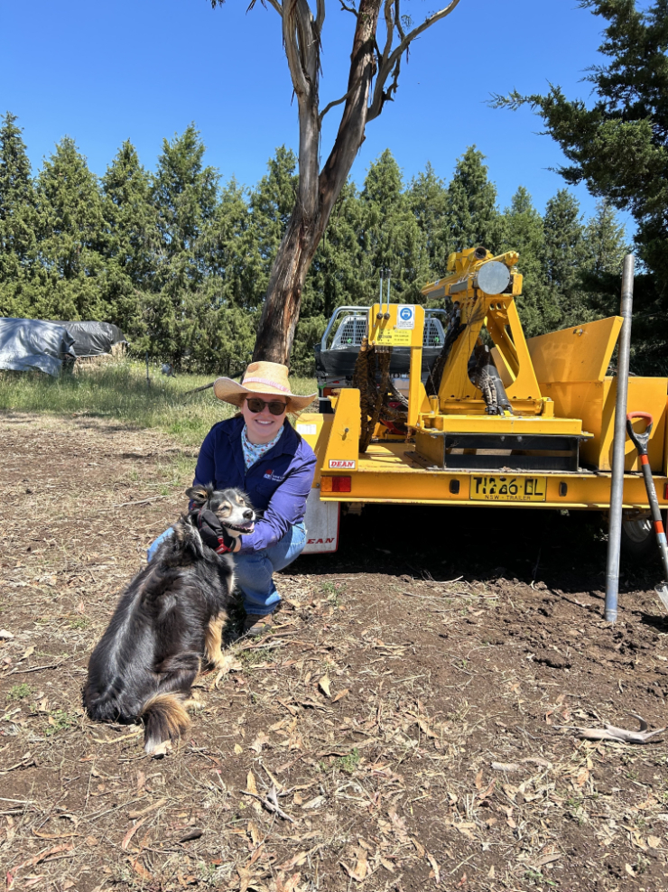 Brianna Carney with a dog on a farm