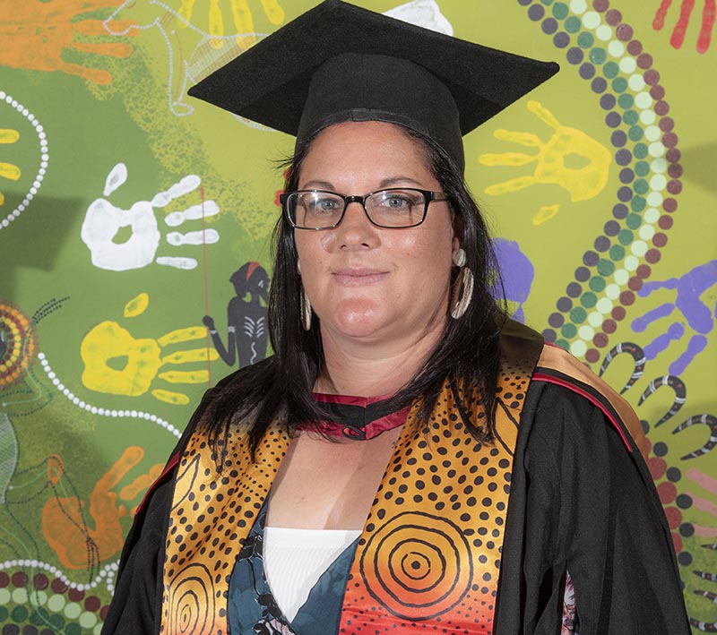 Julie Eggins in her formal Graduation gown and Aboriginal Sash.