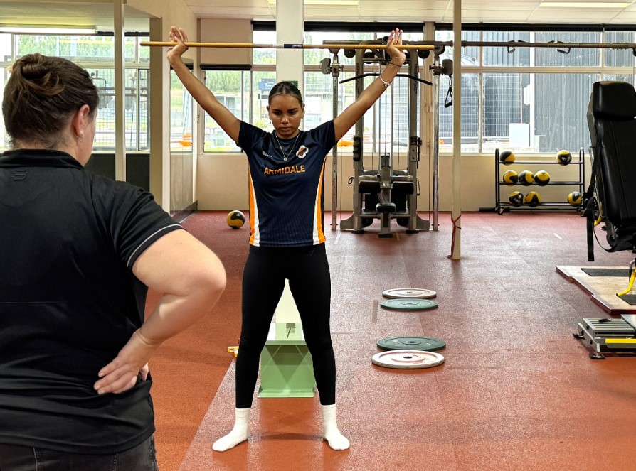 Girl lifting a weight