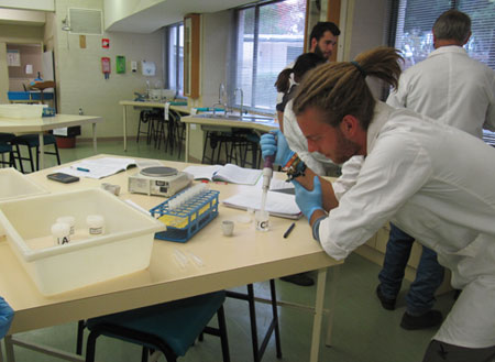 Student conducting pollution science laboratory work