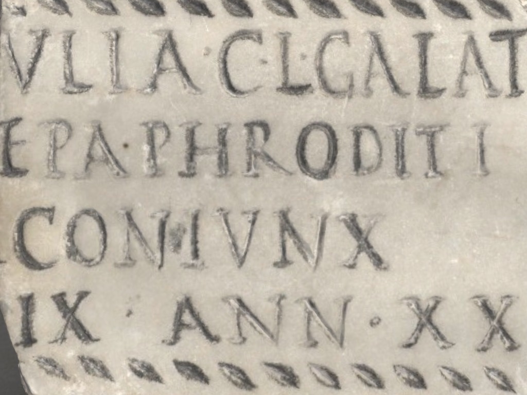 A stone tablet with latin carved into it
