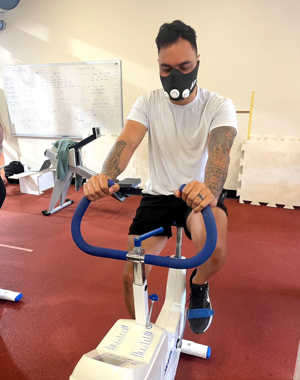 Bobbi Depp riding an exercise bike during intensive schools