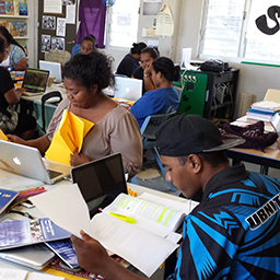 A busy classroom of Nauruan teaching students at work on their laptops in the UNE study centre in Nauru