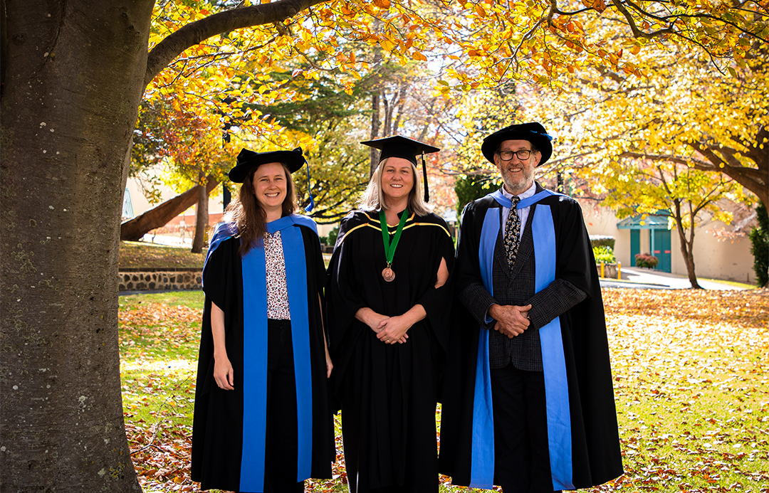 Shelley standing with her supervisors, Dr Rose Andrew and Emeritus Professor Jeremy Bruhl following the Autumn graduation ceremony.