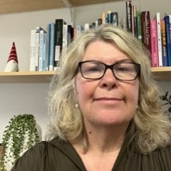 UNE PhD graduate and lecturer Louise Taylor close-up in office