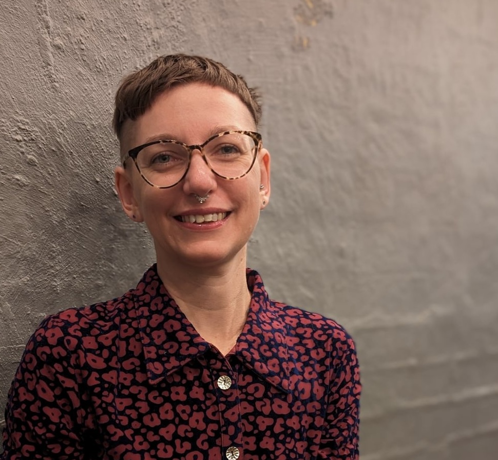 Dr Ariella van Luyn wearing a purple pattern shirt