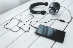 Photo of smartphone and headphones