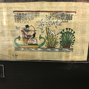 Colourful ancient Egyptian scene on a rough ancient papyrus leaf