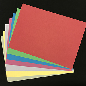 Fanned out ream of plain colourful A4 printer paper