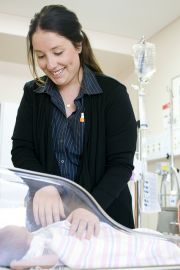 Nursing student checking an infant patient