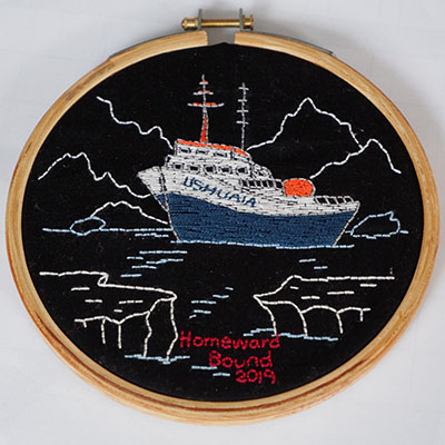 Needle point of the Antarctic with a research boat surrounded by iceberg 