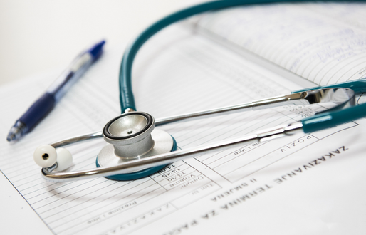 Close-up of a Stethoscope on top of a workpad 