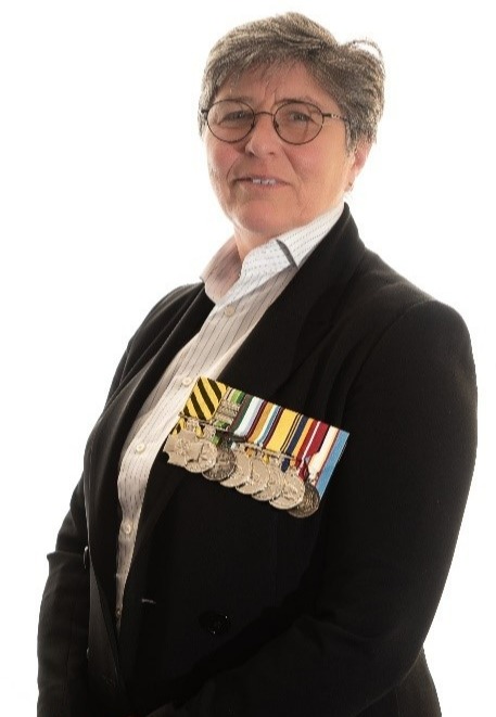 Profile picture of Dr Bernadette Boss CSC wearing suite and military medals 