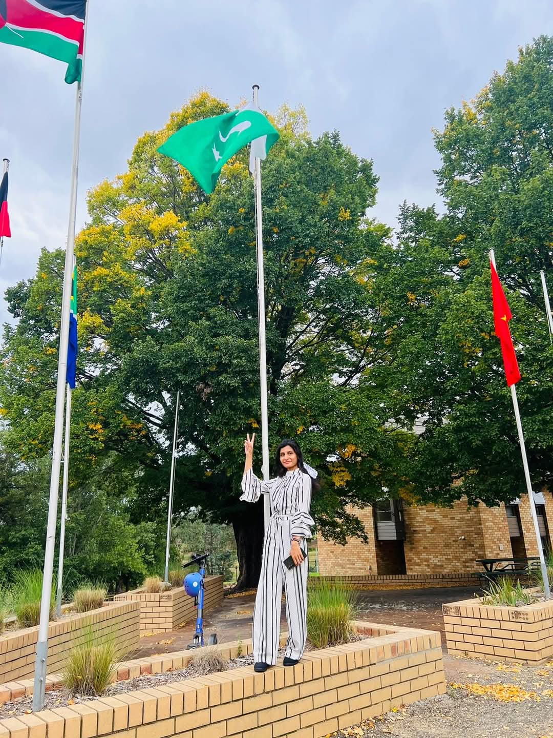 Anam with her country's flag in Wright Village