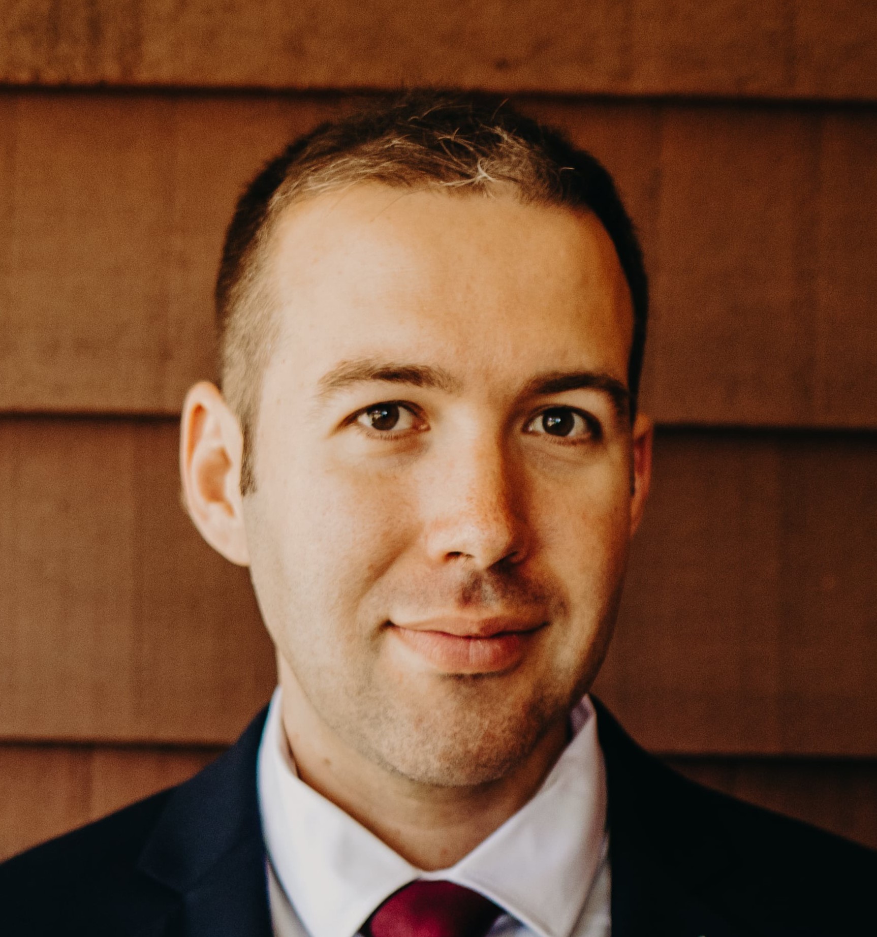 Smiling portrait of a young male academic 
