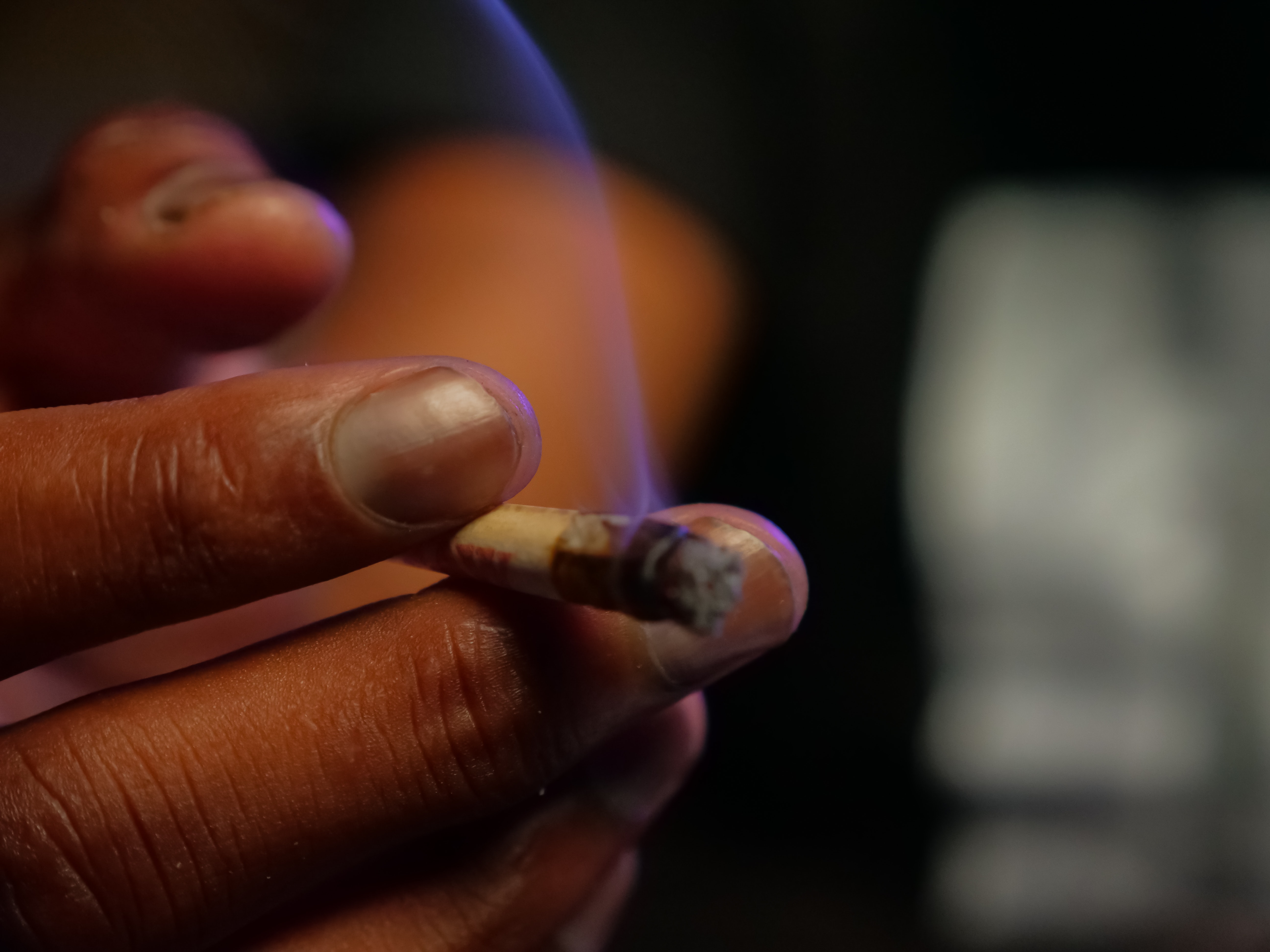 Hand holding a joint