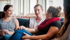 Students in conversation in common room