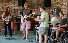 Group of students collaborating in Duval music room