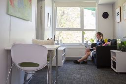 Wright College apartment with large window and painted white.