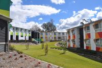 The three apartment blocks in Wright College, each showing their unique colour schemes: red, yellow and green.