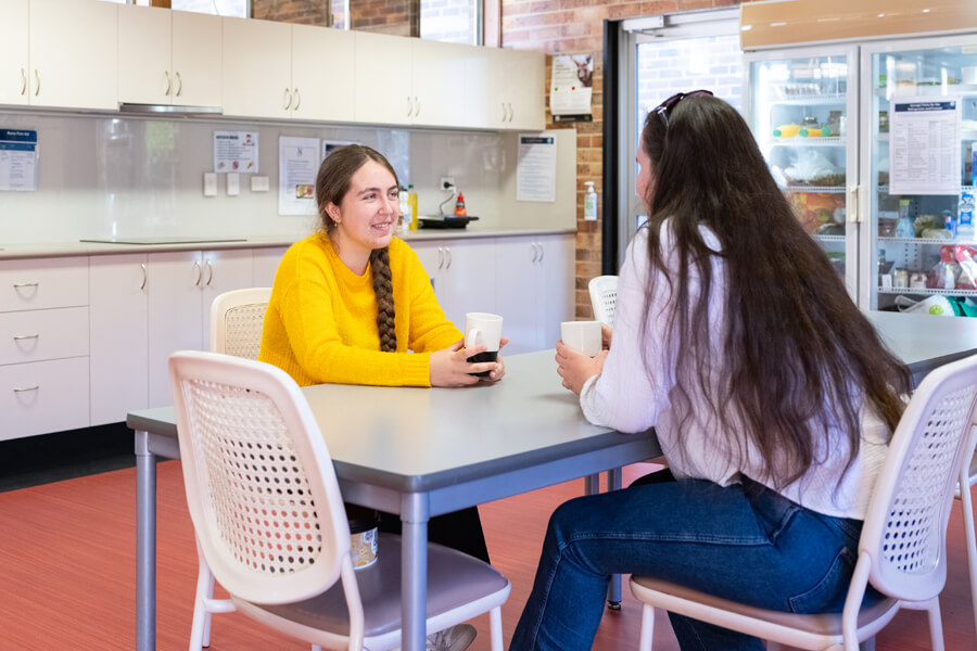 Students sitting in Communal Kitchen