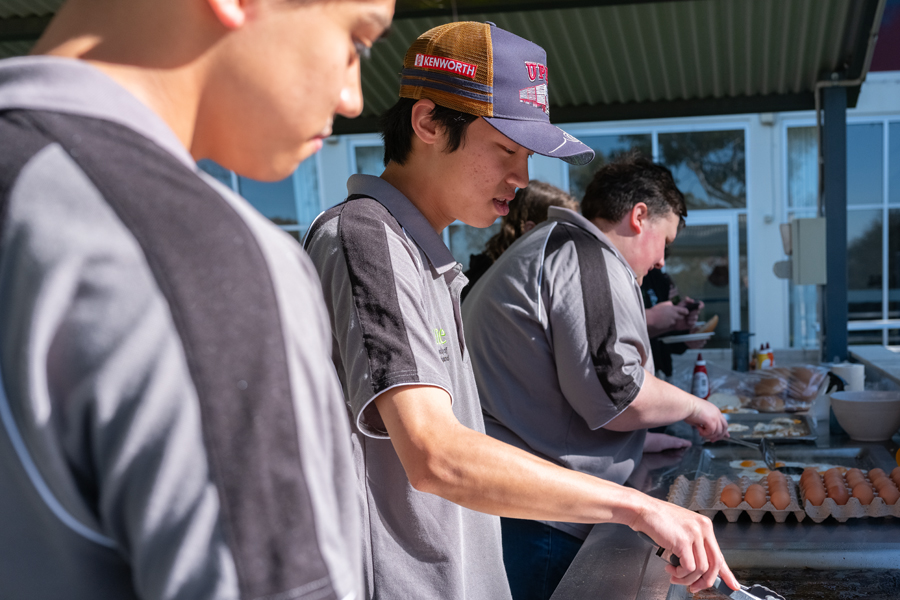 Students cooking a BBQ