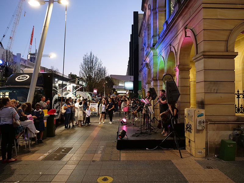 Parramatta street scene at dusk with a celebratory atmosphere